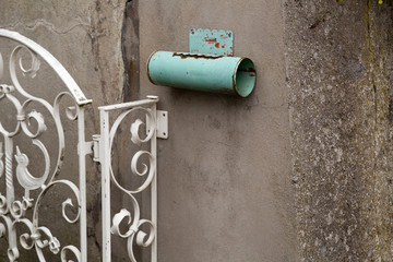 empty old mail box in pipe shape