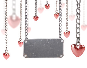dark metal blank old label between small red hearts
