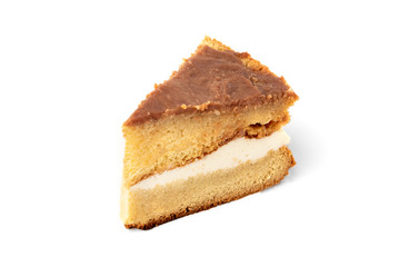 Slice of homemade cake isolated on white background.