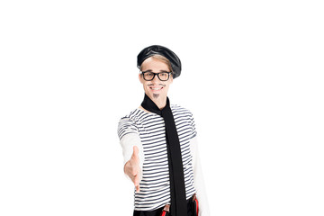 smiling french man in black beret and scarf with greeting gesture isolated on white