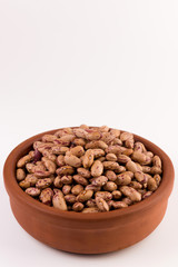 A plate of beans on white background