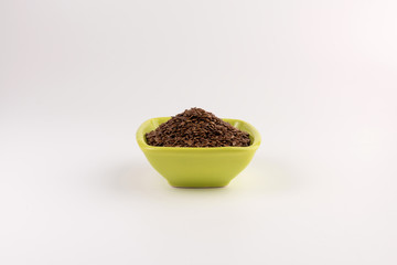 flax seeds in bowl on table background
