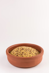 bowl of raw bulgur and quinoa isolated on white background