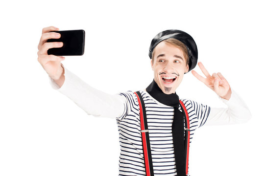 happy french man taking selfie on smartphone isolated on white