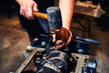 Automotive four-cylinder engine water cooling during repair.