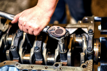 Automotive four-cylinder engine water cooling during repair.