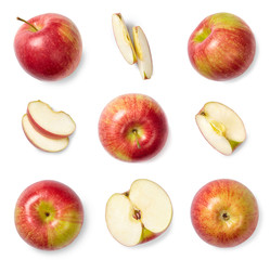 A set of red sliced and whole apples, cut out. Top view.