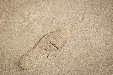 Beautiful footprints in the sand sea nature background