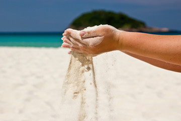 Fototapeta na wymiar Sand in hands