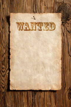 old wanted advert on wooden wall