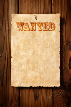 old wanted advert on wooden wall