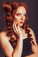Fototapeta premium Ginger girl with professional make up on black background. Beauty, freckles concept