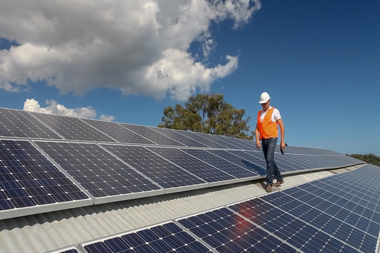 Abstract, blur, bokeh background, defocusing - image for the background. A man working at solar power station