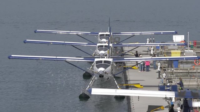 People boarding seaplane in Vancouver Harbour from Vancouver Convention Centre, Vancouver, British Columbia, Canada, North America