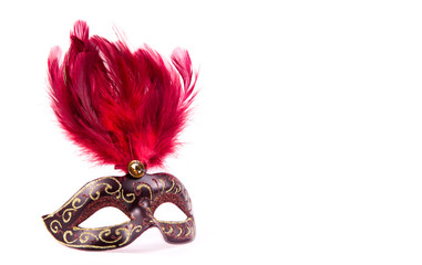 Carnival mask with red feathers. Carnival mask on white background. Copy space