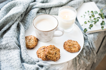 Cozy weekend breakfast with cup of coffee and cookies on ceramic tray