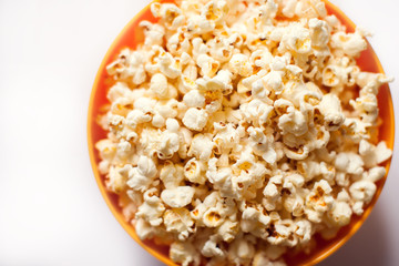 A bowl with popcorn isolated on white background. Food concept