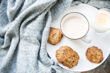 Cozy weekend breakfast with cup of coffee and cookies on ceramic tray