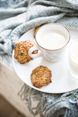 Cozy weekend breakfast with cup of coffee and cookies on ceramic tray