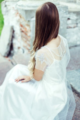 Naklejka premium Wedding portrait of young sensual elegant glamour luxury girl in old historical park 