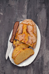 corn bread with knife on white dish