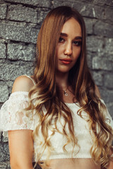 Fototapeta premium Elegant girl in wedding dress in old historical castle