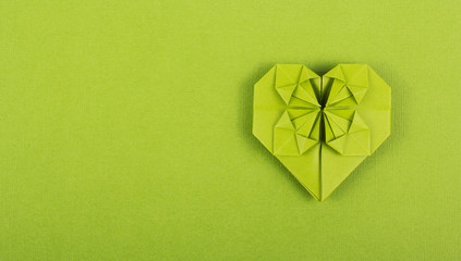 Origami heart on paper background. Paper heart. Copy space. Valentine's day card