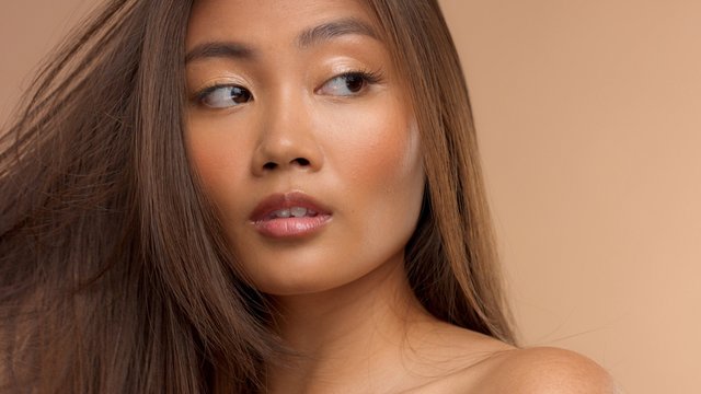 closeup portrait of asian thai japanese model watching aside