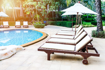pool bed beside swimming pool in tropical resort