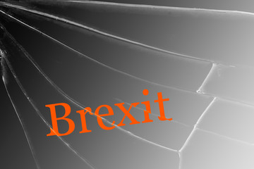 The text Brexit on the broken glass. The concept of a UK exit from the European Union