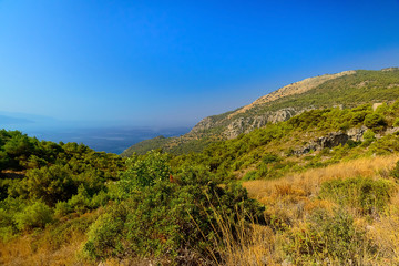 Fototapeta na wymiar View of the green mountains and the sea, Turkey