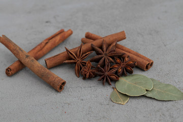 star anise and cinnamon sticks on wooden background