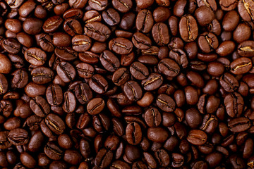 Aroma roasted coffee beans, brown background. Soft focus close up.