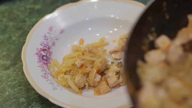 Tasty stewed cabbage is laid out on a plate