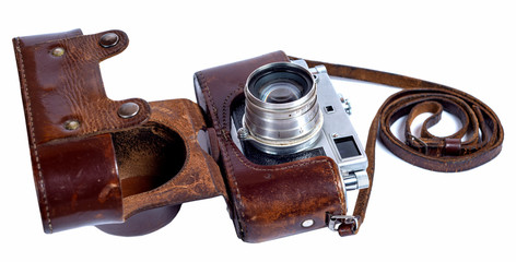 old retro camera in a leather case on a white background