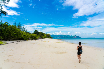 Woman on Beautiful Tropical Beach PP Island, Krabi, Phuket, Thailand blue ocean background girl items vacation accessories for holiday or long weekend a guide  choice idea for planning travel