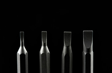 Set of bits for screwdriver. Metal bits for screwdriver. Tool set for household use. Nozzles and adapters for screwdrivers. Head different size hex driver.