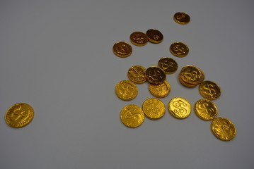 Gold coins with reflection, valuable gold money, cents with beautiful yellow expensive color on a white background