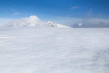 Fototapeta na wymiar Snezka mountain on a beautiful winter day in Krkonose