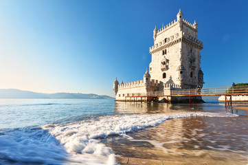Lisbon. The magnificent Belem Tower in Manueline style on the background of the Tejo River in the...