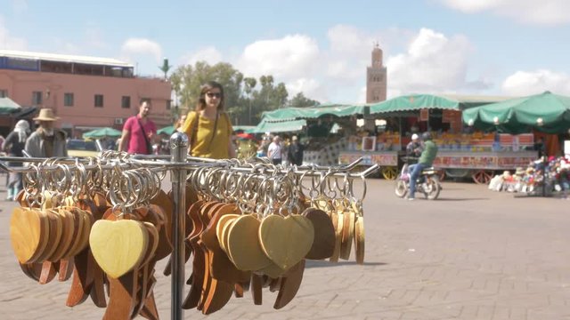 Tourists, taxis and activity on Djemaa el Fna showing Koutoubia Minaret, Marrakech, Morocco, North Africa, Africa