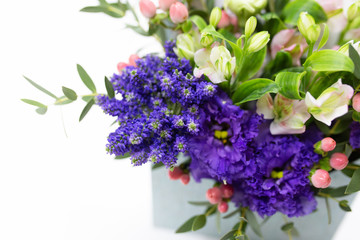 Close-up of a bright purple flower in a flower arrangement