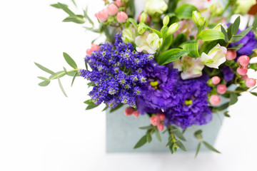 Close-up of a bright purple flower in a flower arrangement