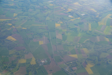 Aerial view of France rural landscape with some Canola flower blossom