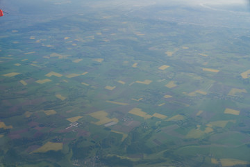 Aerial view of France rural landscape with some Canola flower blossom