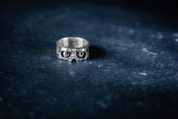 Scull shape ring on slate background
