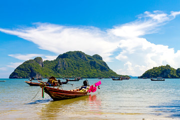 Fototapeta na wymiar Beach and small boat with sunshine at Baan Koh Teap