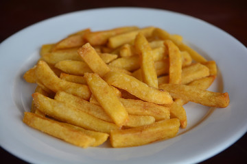 Close up French fries on white plate. food