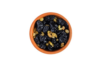 Dried plum and grapes in a bowl on a white background isolate top view