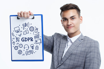 Business, technology, internet and networking concept. Young entrepreneur showing keyword: GDPR